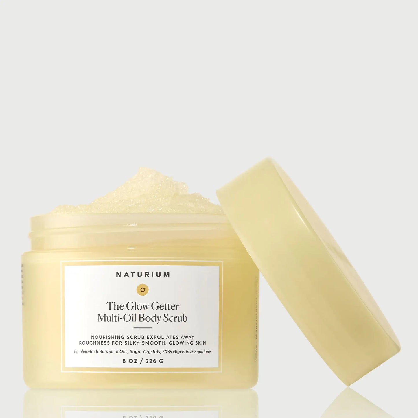 the-glow-getter-multi-oil-body-scrub-y1 NATR-40028-GlowGetter-Multi-Oil-Body-Scrub-Front-CapOff-bonebkgd.webp