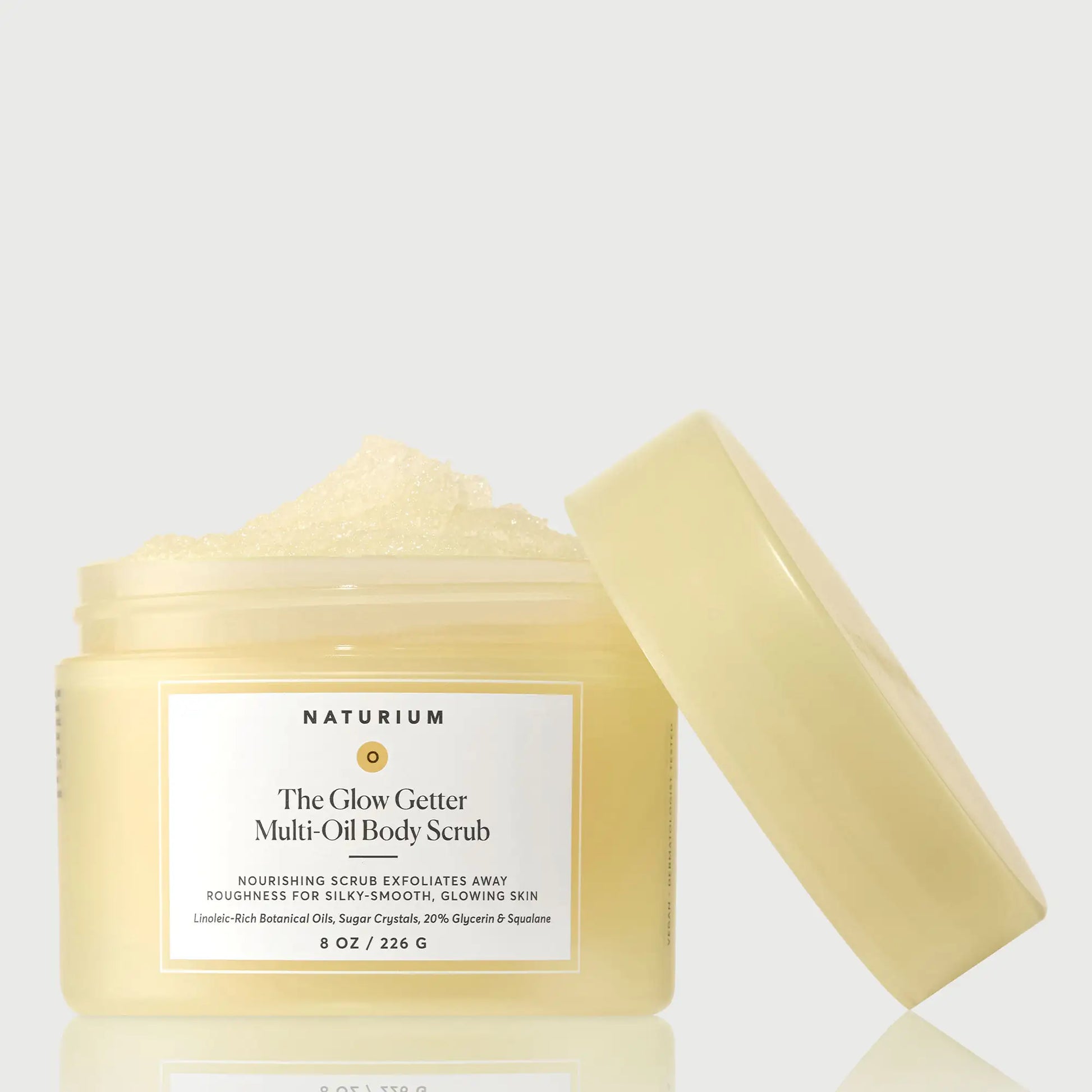 the-glow-getter-multi-oil-body-scrub-y1 NATR-40028-GlowGetter-Multi-Oil-Body-Scrub-Front-CapOff-bonebkgd.webp